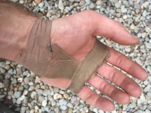 I learned some taping technique during my climbing days. It hurt to hold my car steering wheel, so I figured it'd be wise to tape up my palm before doing an adventure ride.